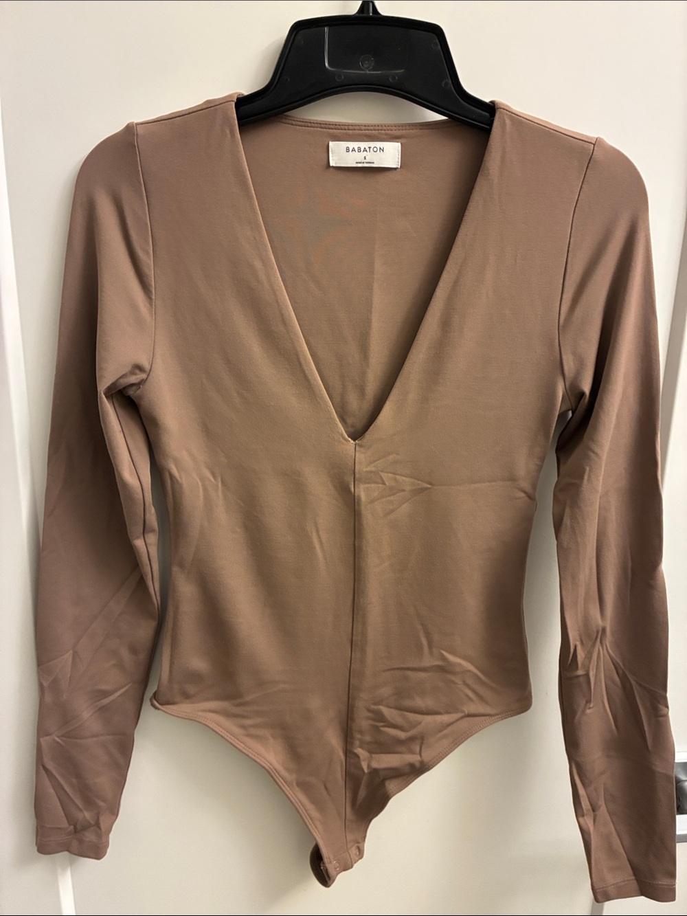 Babaton Long-Sleeve V-Neck Bodysuit in brown.